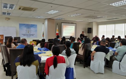 <p><strong>DEV'T OF CHILDREN'S BOOKS</strong>. Author Dr. Luis P. Gatmaitan talks about story creation during the opening of the ‘Training Workshop on the Development of Children’s Books in Mother Tongue’ hosted by the Iloilo City Government, May 15-17 at the City Hall Penthouse. <em>(Photo by Perla Lena) </em></p>